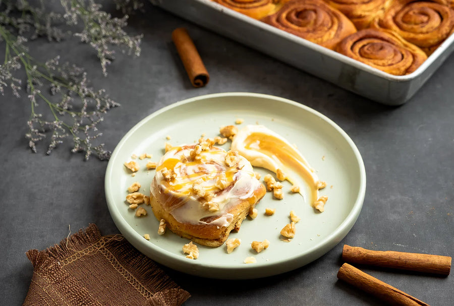 Cinnamon Keto Roll covered with cheese frosting & caramel (With Gluten)